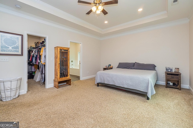 40 Westbrook Rd, Carrollton, GA 30116 - carpeted bedroom featuring a spacious closet, ornamental molding, a closet, a raised ceiling, and connected bathroom