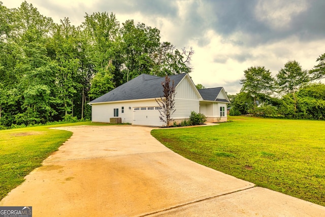 40 Westbrook Rd, Carrollton, GA 30116 - view of home's exterior featuring driveway, a lawn, an attached garage, and board and batten siding