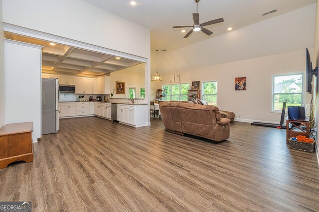 40 Westbrook Rd, Carrollton, GA 30116 - living room featuring recessed lighting, dark wood finished floors, healthy amount of natural light, a ceiling fan, and coffered ceiling