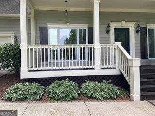 852 Georgetowne Dr, Winder, GA 30680 - view of exterior entry with covered porch