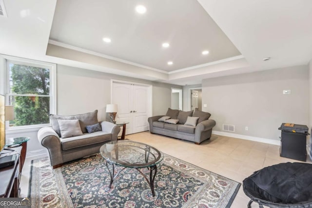 3887 Hickory Manor Dr, Suwanee, GA 30024 - living room featuring a tray ceiling, recessed lighting, ornamental molding, and light tile patterned floors