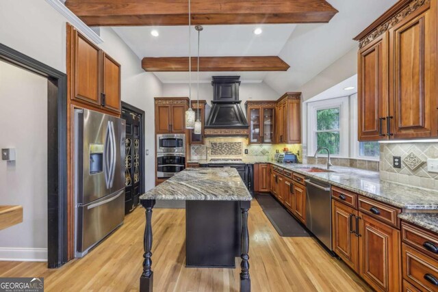 3887 Hickory Manor Dr, Suwanee, GA 30024 - kitchen with stainless steel appliances, light stone countertops, light wood finished floors, custom range hood, and tasteful backsplash