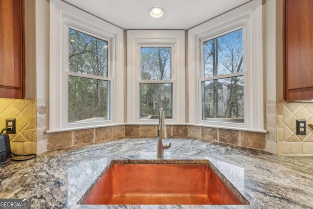 3887 Hickory Manor Dr, Suwanee, GA 30024 - kitchen view of stone counters and backsplash