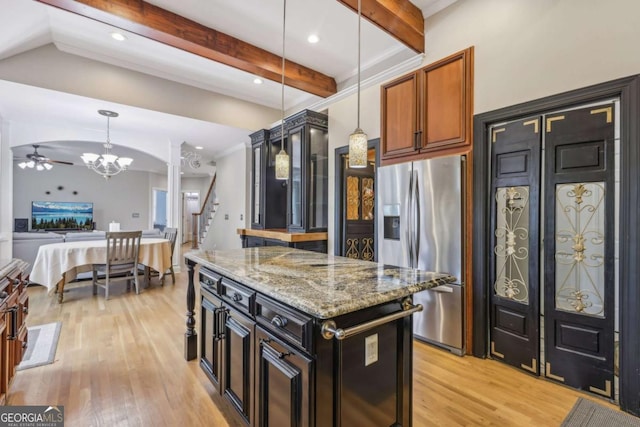3887 Hickory Manor Dr, Suwanee, GA 30024 - kitchen with stainless steel fridge, light wood finished floors, light stone countertops, a chandelier, and beam ceiling