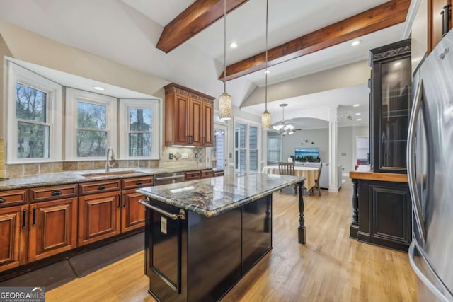 3887 Hickory Manor Dr, Suwanee, GA 30024 - kitchen with appliances with stainless steel finishes, beamed ceiling, decorative backsplash, dark stone countertops, and light wood-style floors