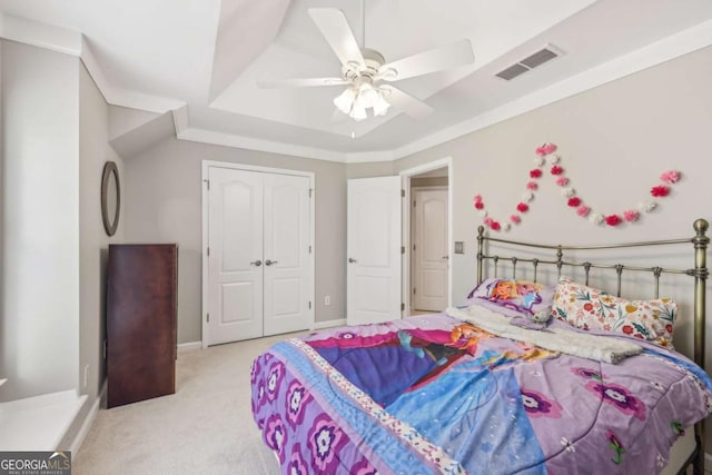 3887 Hickory Manor Dr, Suwanee, GA 30024 - bedroom with light colored carpet, a raised ceiling, a closet, and a ceiling fan