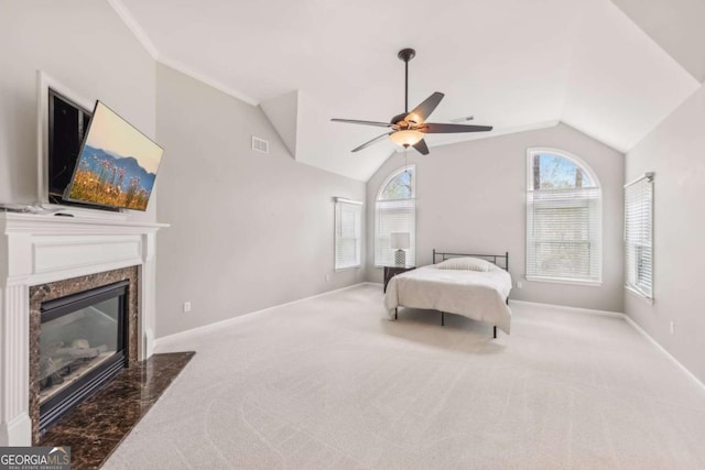 3887 Hickory Manor Dr, Suwanee, GA 30024 - bedroom featuring lofted ceiling, carpet, a high end fireplace, and a ceiling fan
