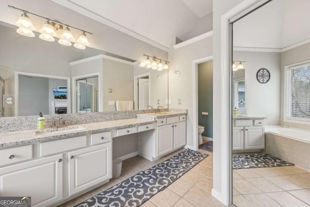 3887 Hickory Manor Dr, Suwanee, GA 30024 - full bathroom with lofted ceiling, double vanity, tile patterned flooring, crown molding, and a bath