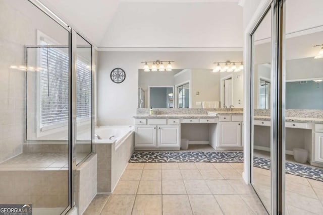 3887 Hickory Manor Dr, Suwanee, GA 30024 - full bathroom with vanity, a garden tub, tile patterned floors, a stall shower, and lofted ceiling