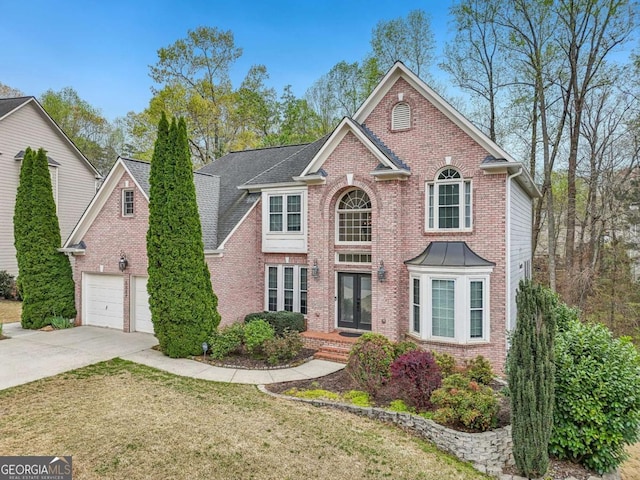 3887 Hickory Manor Dr, Suwanee, GA 30024 - view of front of property with brick siding, driveway, and a front lawn