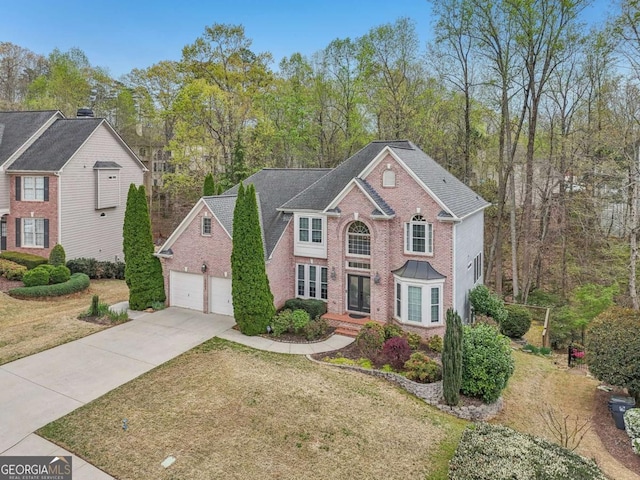 3887 Hickory Manor Dr, Suwanee, GA 30024 - view of front of property featuring brick siding, concrete driveway, and a front lawn