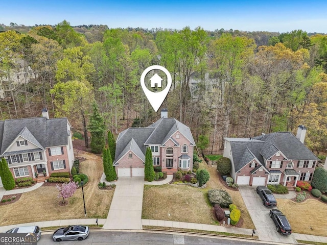 3887 Hickory Manor Dr, Suwanee, GA 30024 - aerial view of property and surrounding area with a heavily wooded area