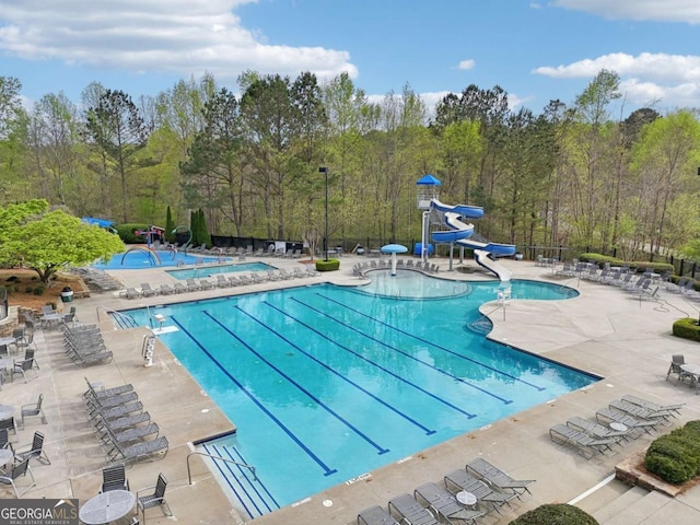 3887 Hickory Manor Dr, Suwanee, GA 30024 - community pool featuring a water slide and a patio area