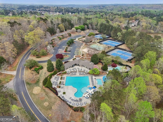 3887 Hickory Manor Dr, Suwanee, GA 30024 - aerial view of property's location featuring a pool and a heavily wooded area