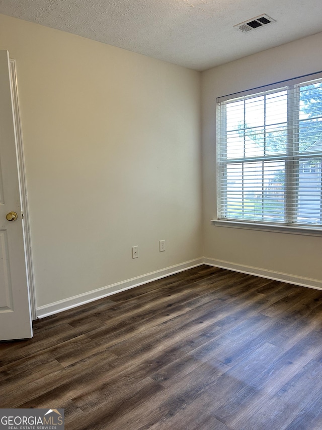 375 Sapphire Bnd, Riverdale, GA 30296 - unfurnished room featuring dark wood-type flooring and a textured ceiling