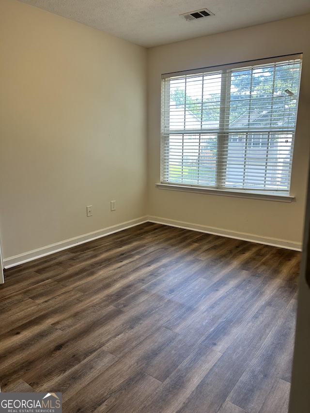 375 Sapphire Bnd, Riverdale, GA 30296 - unfurnished room featuring dark wood-style floors and baseboards