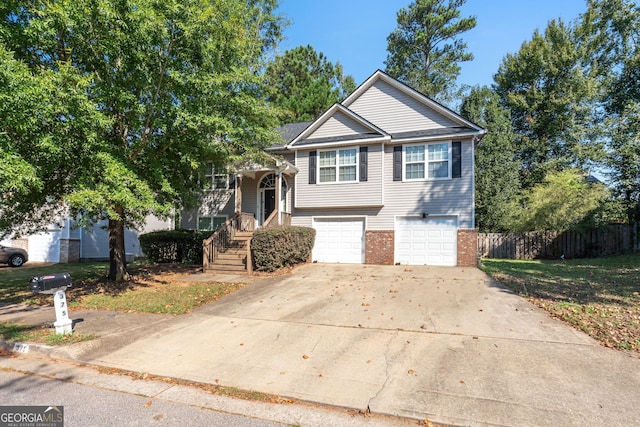 375 Sapphire Bnd, Riverdale, GA 30296 - view of front of home with an attached garage, driveway, and brick siding