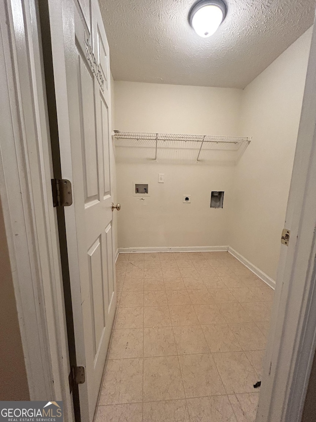 375 Sapphire Bnd, Riverdale, GA 30296 - laundry room with hookup for an electric dryer, washer hookup, and a textured ceiling
