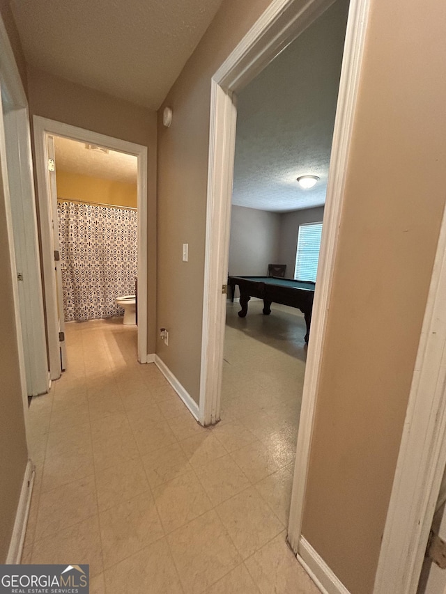 375 Sapphire Bnd, Riverdale, GA 30296 - corridor with a textured ceiling and baseboards