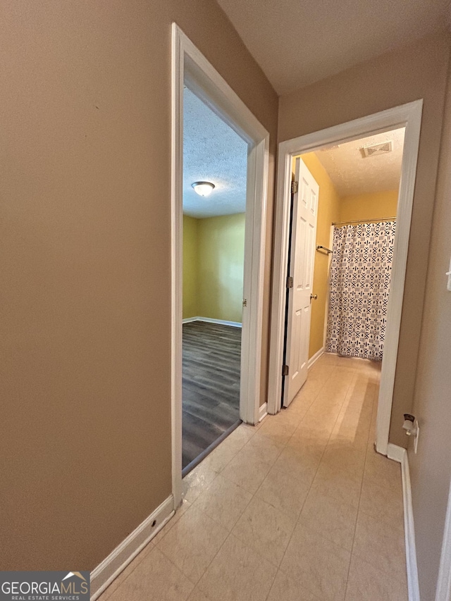 375 Sapphire Bnd, Riverdale, GA 30296 - hall featuring baseboards and light tile patterned floors