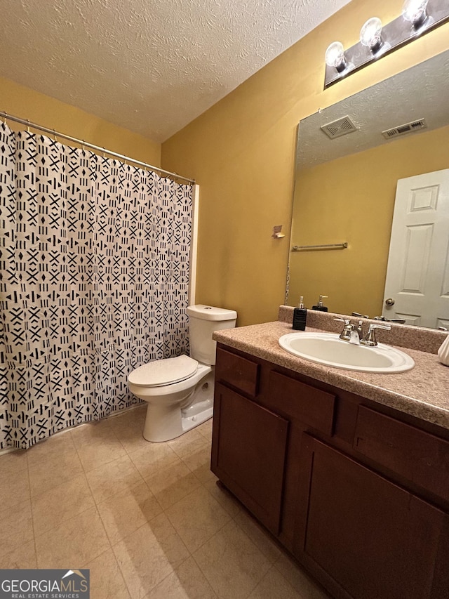 375 Sapphire Bnd, Riverdale, GA 30296 - full bath with vanity, a textured ceiling, tile patterned flooring, and a shower with curtain