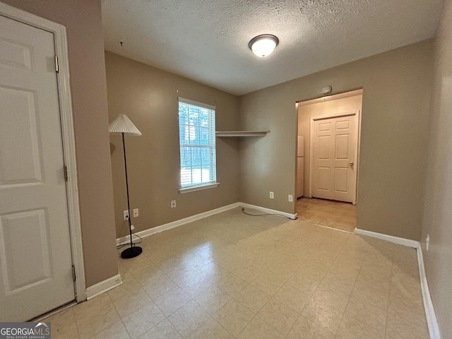 375 Sapphire Bnd, Riverdale, GA 30296 - unfurnished room with a textured ceiling and light flooring