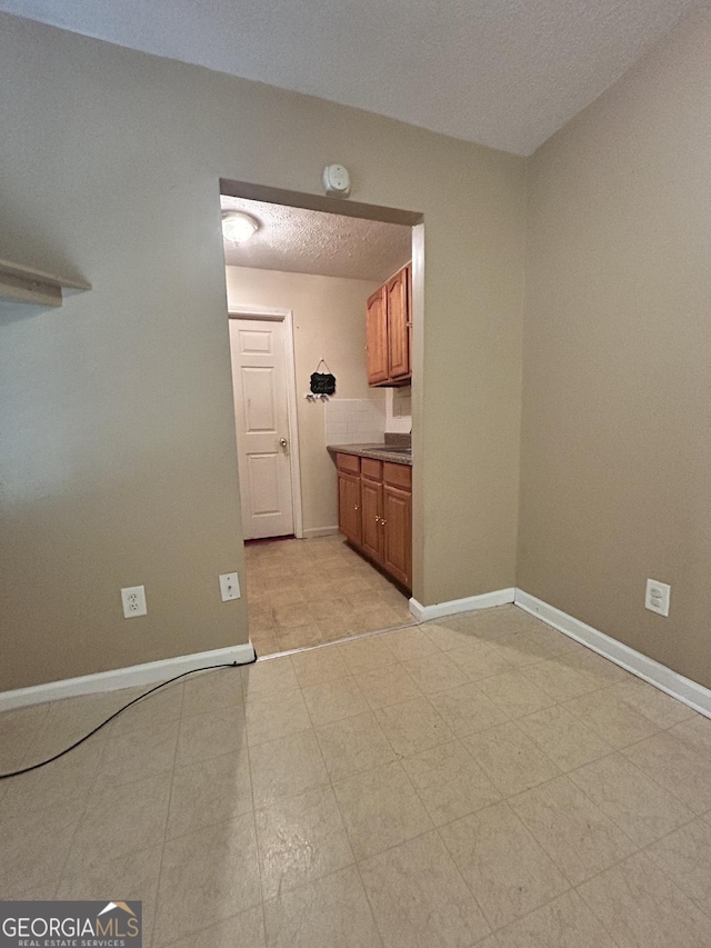 375 Sapphire Bnd, Riverdale, GA 30296 - empty room featuring baseboards and a textured ceiling