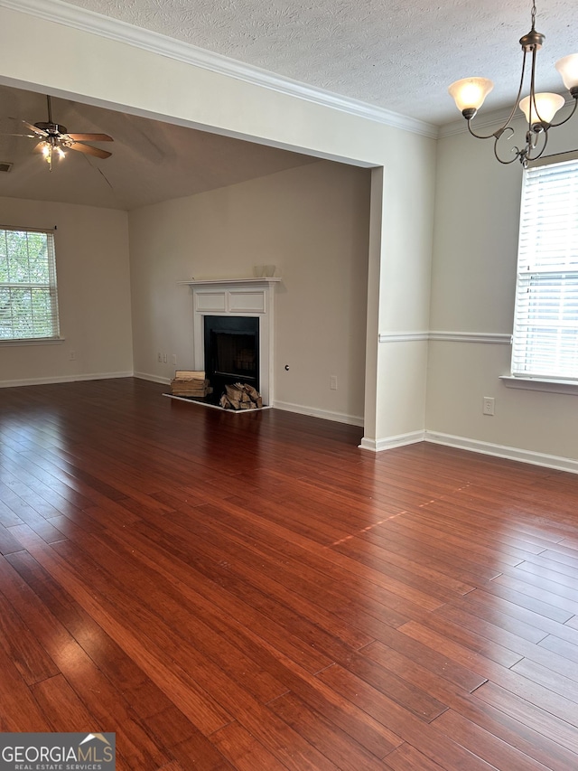 375 Sapphire Bnd, Riverdale, GA 30296 - unfurnished living room featuring a fireplace, hardwood / wood-style floors, crown molding, a textured ceiling, and a ceiling fan