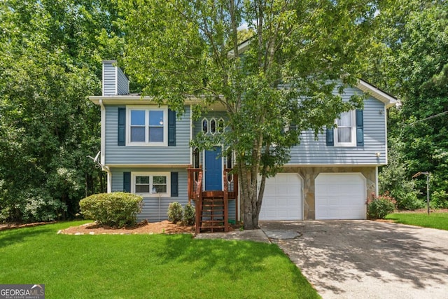 3450 Saddleton Way, Douglasville, GA 30134 - raised ranch featuring a chimney, a front lawn, a garage, and driveway