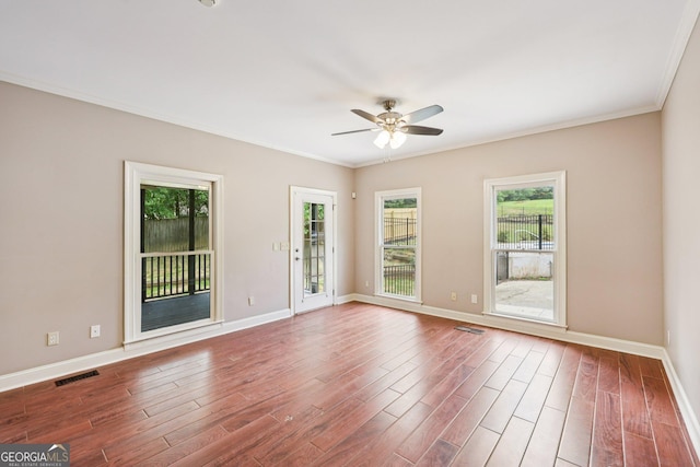 4685 Braselton Hwy, Hoschton, GA 30548 - spare room with a ceiling fan, plenty of natural light, ornamental molding, and wood finished floors