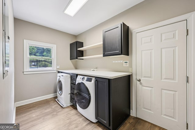 4685 Braselton Hwy, Hoschton, GA 30548 - laundry area featuring cabinet space, washer and dryer, and light wood finished floors