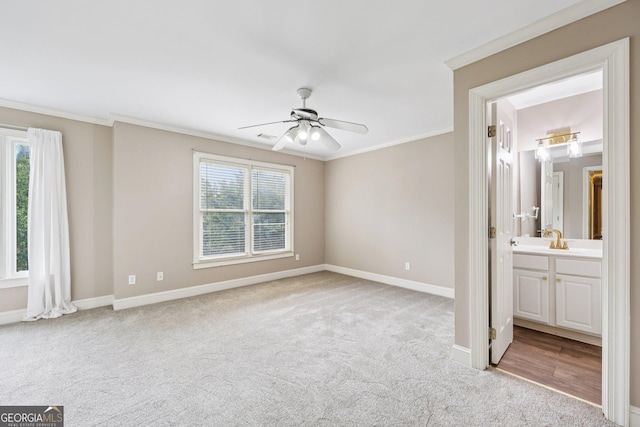 4685 Braselton Hwy, Hoschton, GA 30548 - unfurnished bedroom featuring light colored carpet, crown molding, connected bathroom, and ceiling fan
