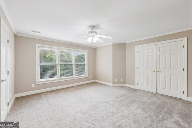 4685 Braselton Hwy, Hoschton, GA 30548 - unfurnished bedroom with ornamental molding, carpet floors, a closet, and a ceiling fan