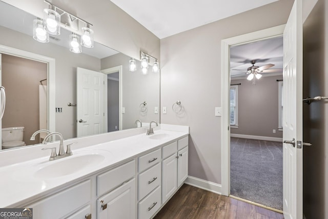 4685 Braselton Hwy, Hoschton, GA 30548 - full bath featuring double vanity, ceiling fan, and wood finished floors