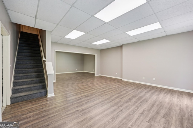 4685 Braselton Hwy, Hoschton, GA 30548 - unfurnished living room featuring stairway, wood finished floors, and a drop ceiling