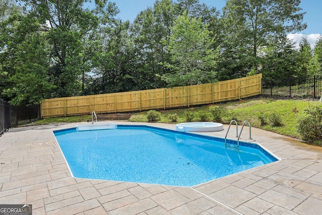 4685 Braselton Hwy, Hoschton, GA 30548 - view of swimming pool featuring a patio area, a fenced backyard, and an in-ground hot tub