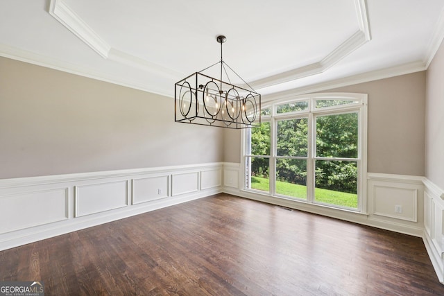 4685 Braselton Hwy, Hoschton, GA 30548 - empty room featuring a chandelier, ornamental molding, a tray ceiling, wainscoting, and dark wood-style flooring