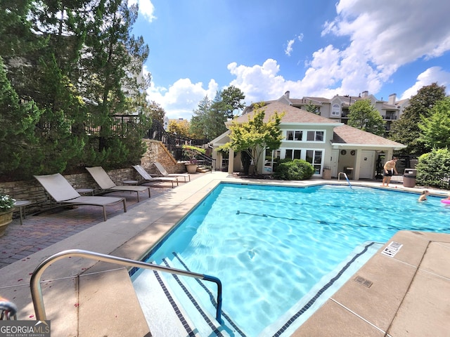 4250 River Green Dr NW Apt 405, Atlanta, GA 30327 - swimming pool with a patio area