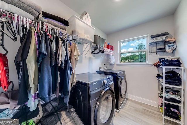 191 Eagle Heights Dr, Maysville, GA 30558 - washroom with washer and clothes dryer and light wood-style floors