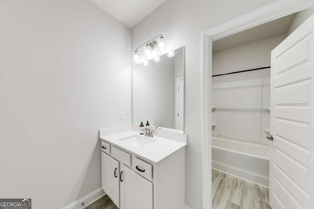 191 Eagle Heights Dr, Maysville, GA 30558 - full bath with vanity, wood finished floors, and bathtub / shower combination