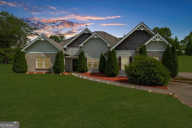 79 Hampton Hills Ln, Cleveland, GA 30528 - craftsman-style house featuring brick siding and a lawn