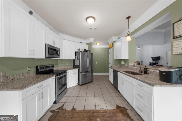 79 Hampton Hills Ln, Cleveland, GA 30528 - kitchen featuring stainless steel appliances, white cabinetry, crown molding, light tile patterned flooring, and hanging light fixtures