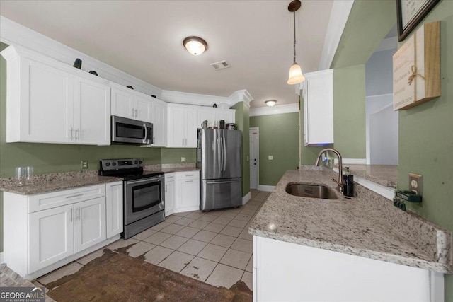 79 Hampton Hills Ln, Cleveland, GA 30528 - kitchen featuring appliances with stainless steel finishes, white cabinetry, ornamental molding, and light stone counters