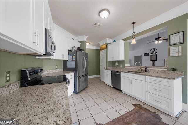 79 Hampton Hills Ln, Cleveland, GA 30528 - kitchen featuring stainless steel appliances, white cabinetry, light tile patterned floors, ornamental molding, and a ceiling fan