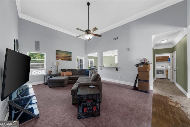 79 Hampton Hills Ln, Cleveland, GA 30528 - carpeted living area with a high ceiling, ceiling fan, crown molding, and washer and dryer