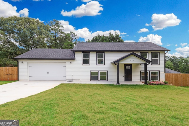 932 Brian Ln, Forest Park, GA 30297 - bi-level home featuring driveway, a garage, and roof with shingles