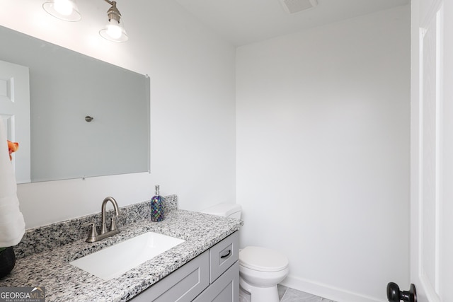 932 Brian Ln, Forest Park, GA 30297 - bathroom featuring toilet and vanity