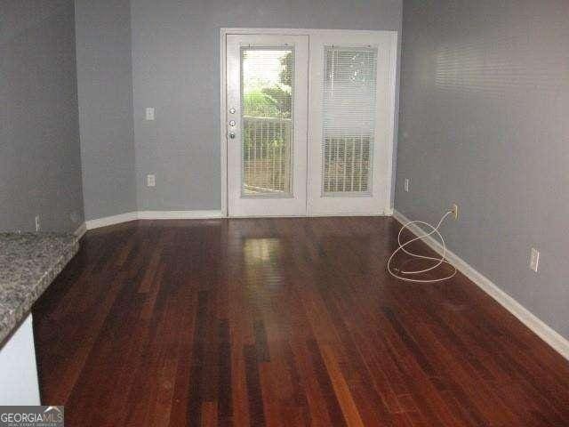 10 Perimeter Summit Blvd NE Unit 3105, Atlanta, GA 30319 - unfurnished room featuring wood finished floors and baseboards