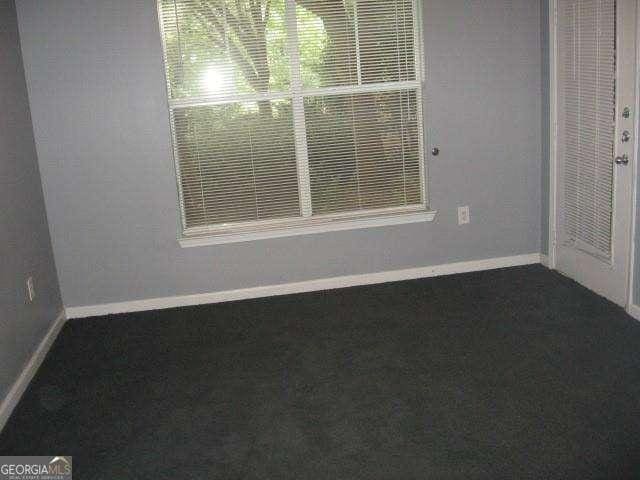 10 Perimeter Summit Blvd NE Unit 3105, Atlanta, GA 30319 - carpeted empty room featuring baseboards