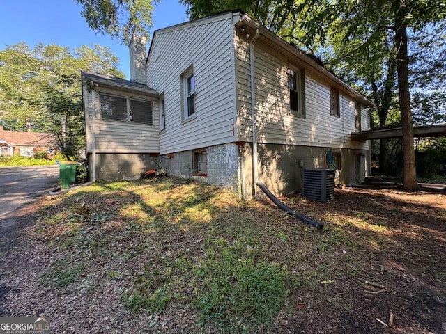 520 Holman Ave, Athens, GA 30606 - view of side of home featuring a cooling unit and a chimney